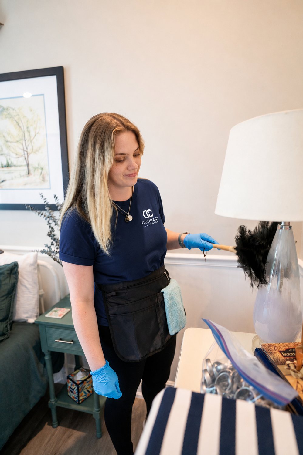 Smiling Connect Cleaning team member in a Southwest Florida home kitchen