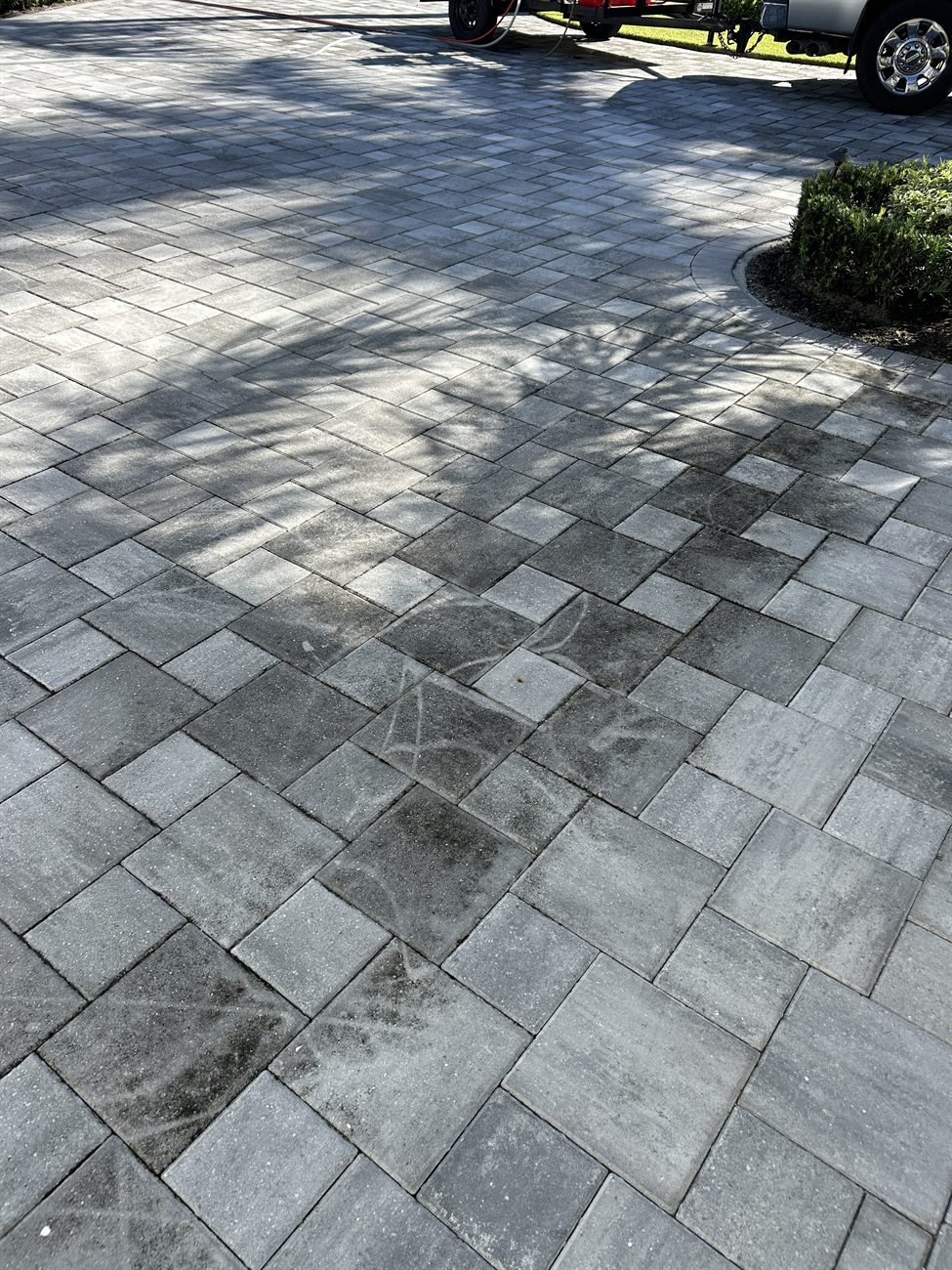 Freshly pressure-washed paver driveway at a Southwest Florida home
